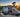Custom Sprinter camper van with open door and modern interior parked in scenic forest at sunset