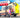 Woman posing by custom Sprinter van with open rear doors on sunny outdoor road