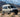 Sandy Vans Sprinter van with Sandbar roof rack, awning, and off-road lights