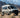Sandy Vans Sprinter van with Sandbar roof rack, awning, and off-road lights