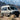 Sandy Vans Sprinter van with Sandbar roof rack, awning, and off-road lights