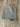 Gray knit beanie with Sandy Vans logo on wooden floor