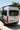Custom Sprinter van with roof rack, off-road tires, and rear ladder for adventure travel and overlanding.