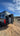 Sprinter camper van on a dirt trail with the Boost Box door and Molle panels open