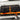 SV Rear Upper Door Storage bag with orange straps and a carabiner on a Mercedes Sprinter rear door