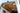 Rear view into a Sprinter van with warm white LED strips routed across the bamboo ceiling