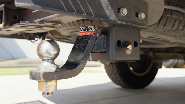 Ball mount stored in the SV Hidden Hitch Holder under a Mercedes Sprinter, out of the way of your shins