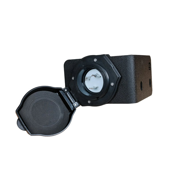 A black 30 amp vanlife electrical outlet cover with its hinged lid open, showing the internal socket contacts, set against a plain white background.
