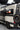Glenn VANzig rear corner with ladder, spare tire on a rack panel and black body stripe
