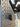 SV Spare Tire Bracket bolted to a perforated SV rack panel, close angle